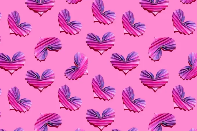 Pattern of pink and purple origami hearts