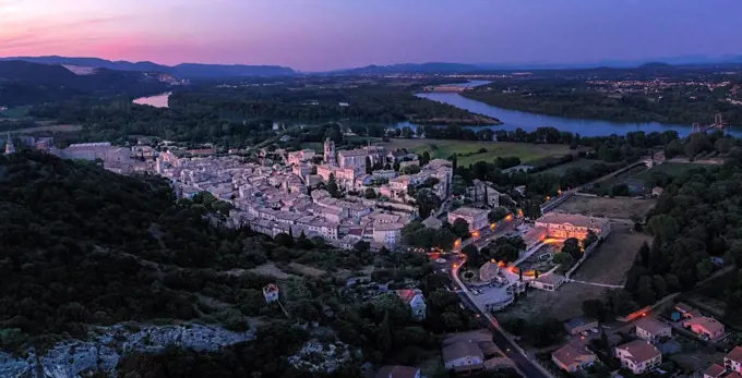 France, Ardeche, Aerial view of medieval town at dusk