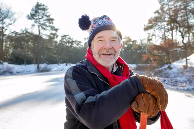 Man with knit hat on snow during sunny day