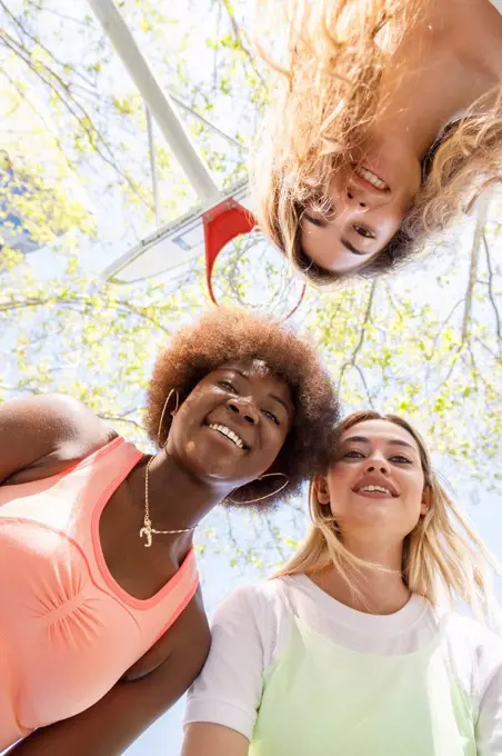 Young women smiling at sports court