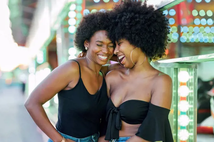 African female friends standing in park