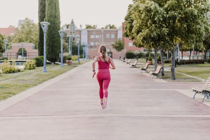 Active female athlete running in park