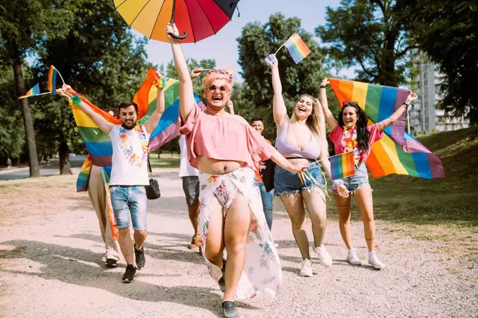 Cheerful male and female activists protesting for equal rights in pride event