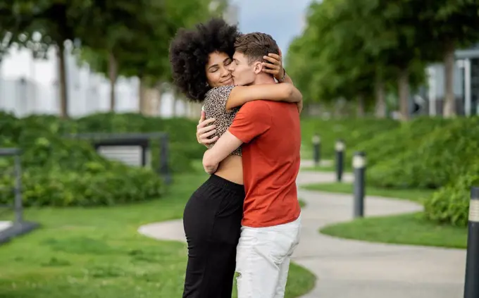 Affectionate couple embracing each other at park