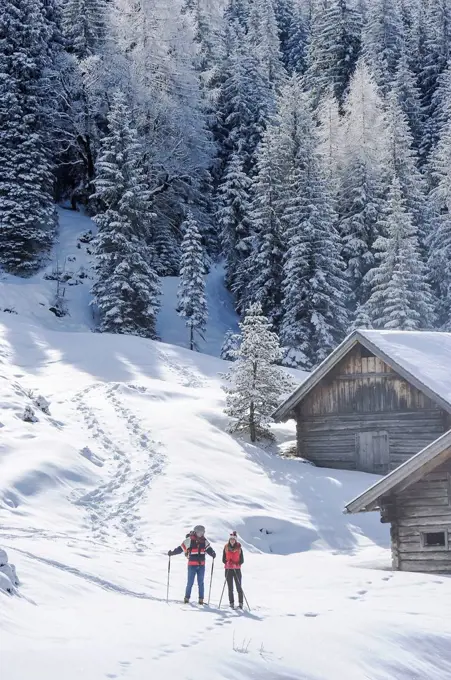 Mid adult couple standing on snow in winter