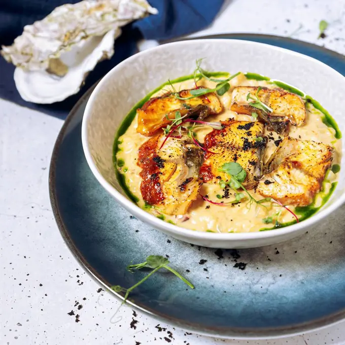 Bowl of risotto with eel and herbs