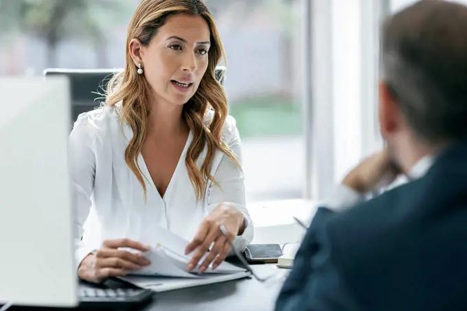 Business colleagues discussing in office