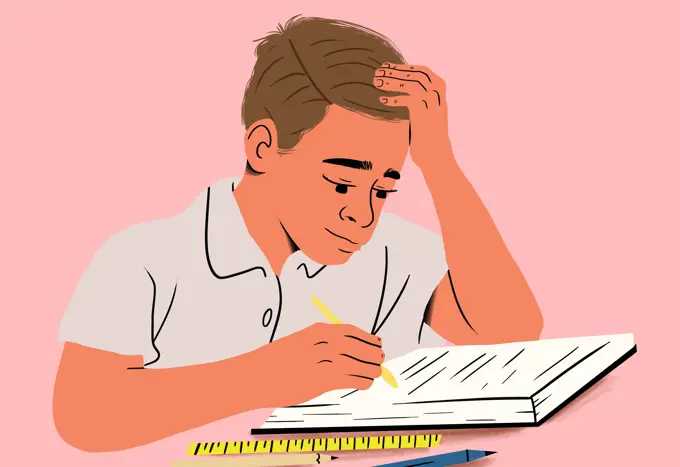 Pensive boy studying intensely with notebook and pencil