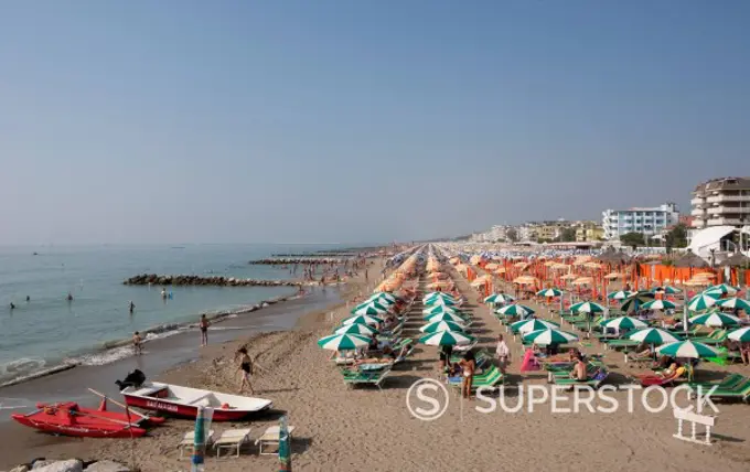 Italy, Province of Venice, Caorle, View of beach with sunsahdes