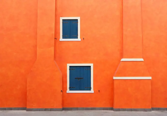 Italy, Province of Venice, Caorle, Facade of building with chimney