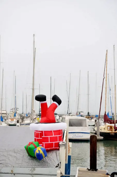 USA, California, San Francisco, boat with Santa Claus figure in harbor