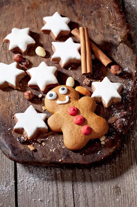 Christmas pastry, Cinnamon stars and gingerbread man on board