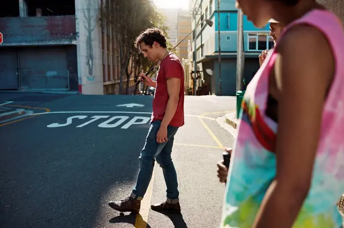 Friends playing urban golf in the city