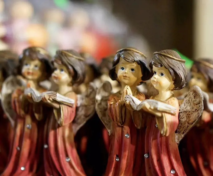 Germany, Christmas decoration with pairs of angel figurines reading book