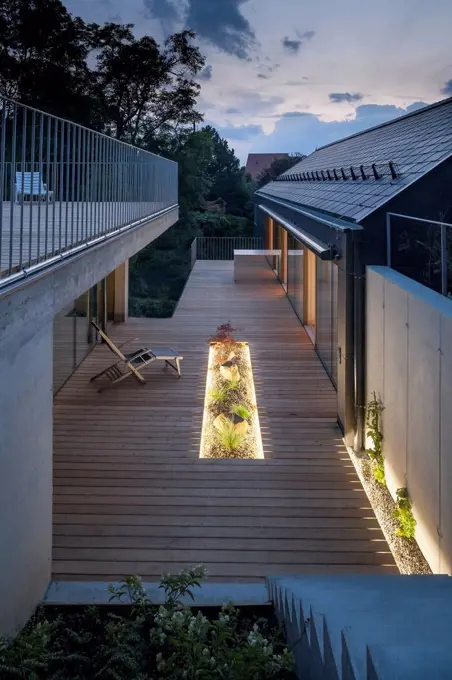 One family house, wooden terrace in the evening