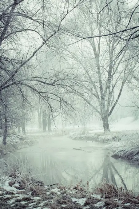 Germany, Bavaria, Landshut, flood channel in winter