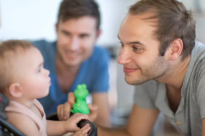 Gay couple with adopted child