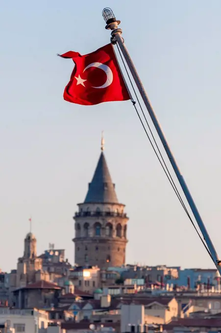 Turkey, Istanbul, Turkish flag in front of Galata Tower