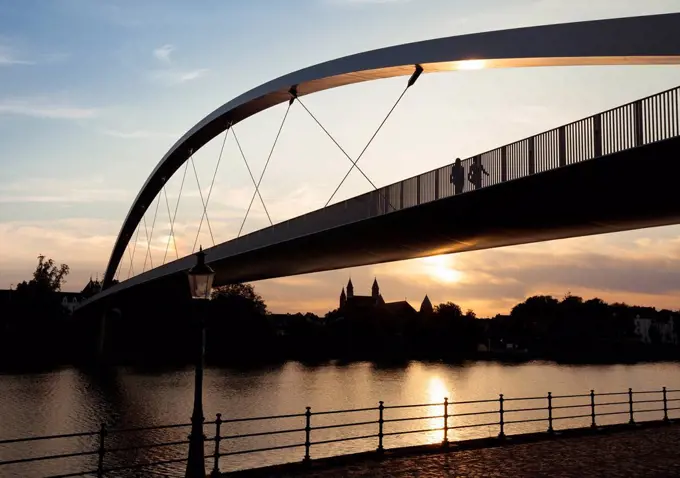 Netherlands, Maastricht, Meuse river and Hoge Brug at sunset