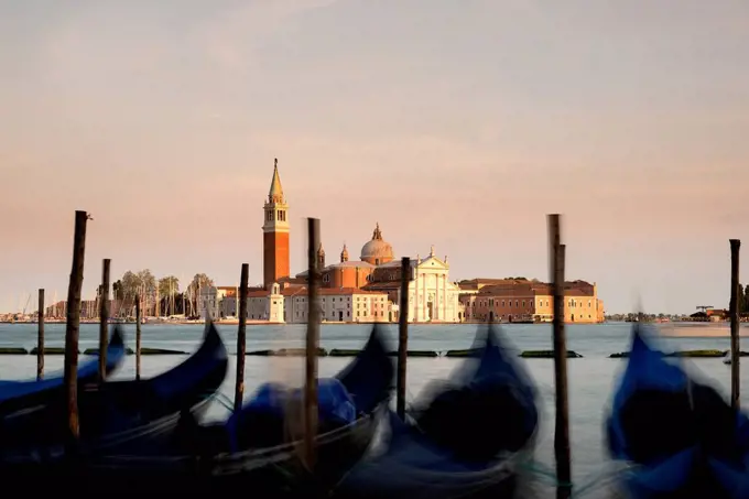 Italy, Venice, gondolas in front of San Giorgio Maggiore at dusk