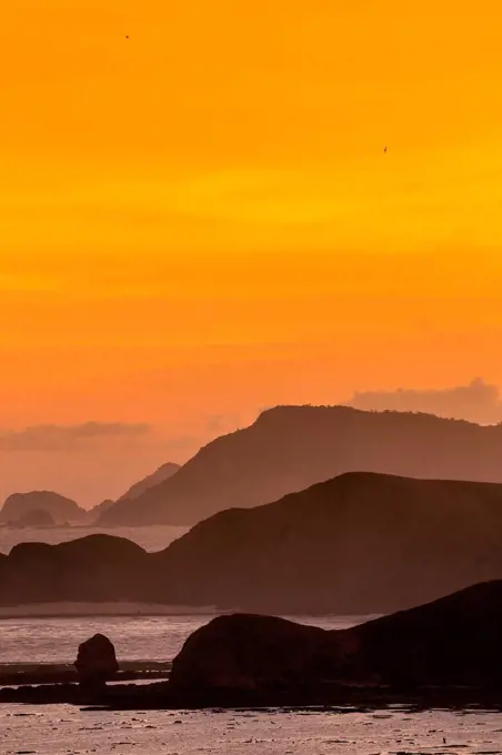 Indonesia, Bali, Coastline of Lombok island at sunset