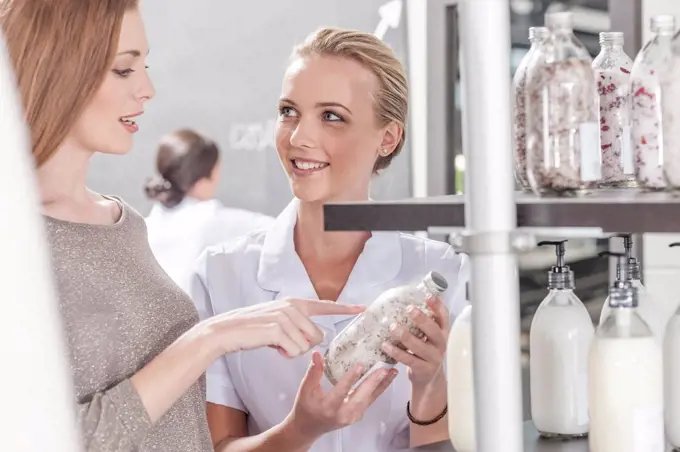 Client and shop assistant talking in wellness shop