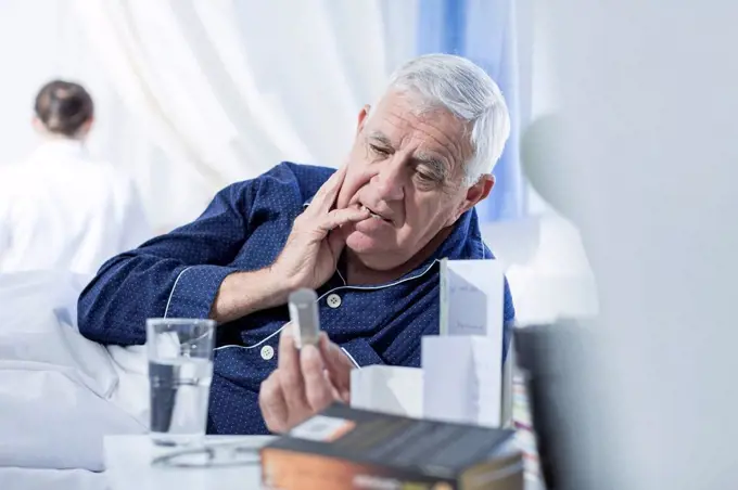 Patient in hospital taking medication