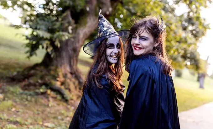 Portrait of two masquerade girls at Halloween