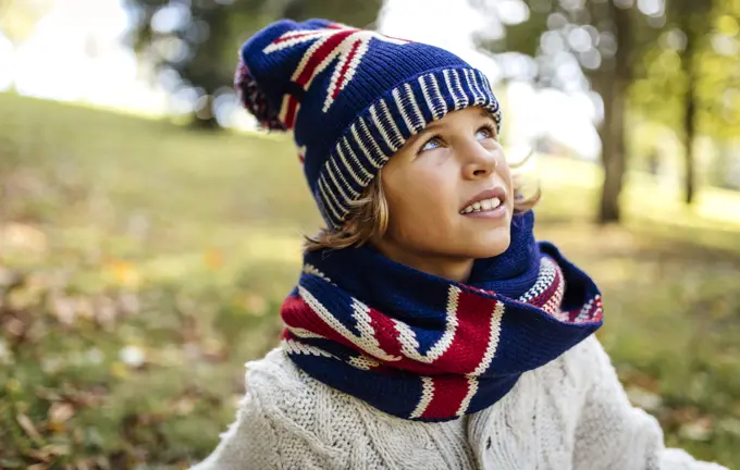 Portrait of blond boy wearing fashionable knit wear in autumn