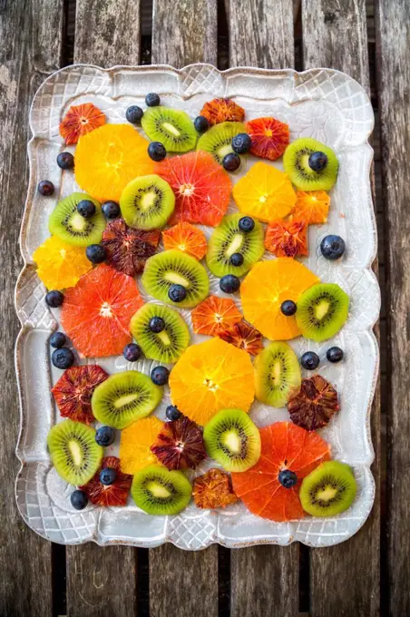 Tray of different sliced citrus fruits