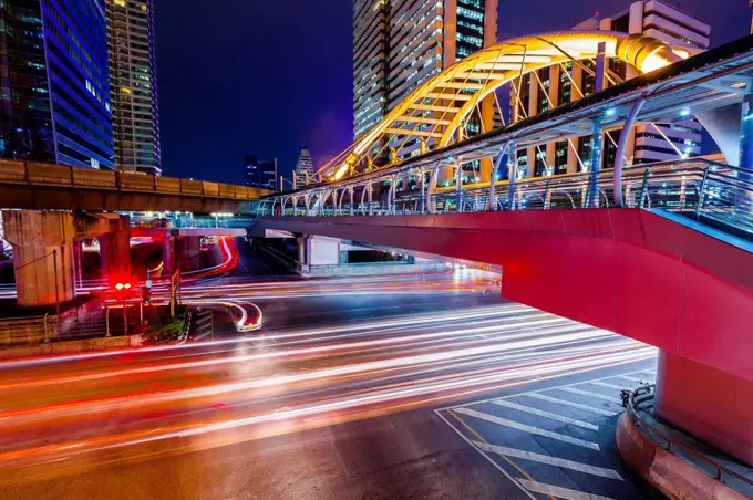 Thailand, footbridge and traffic in Bangkok at night