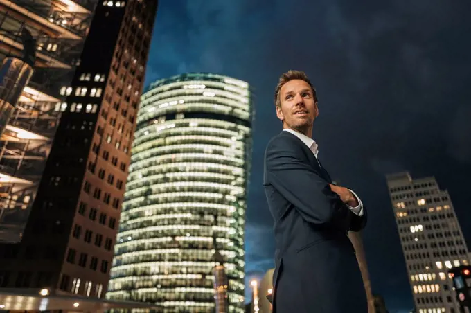 Germany, Berlin, Potsdamer Platz, portrait of businessman at night