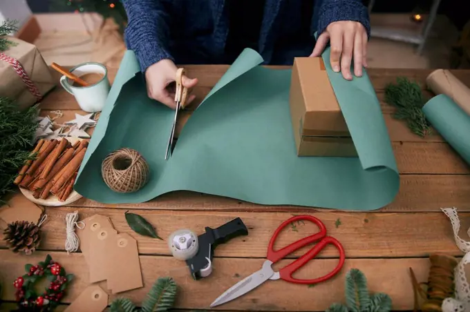 Woman wrapping christmas gifts