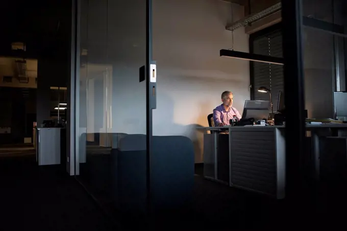 Businessman working late in office