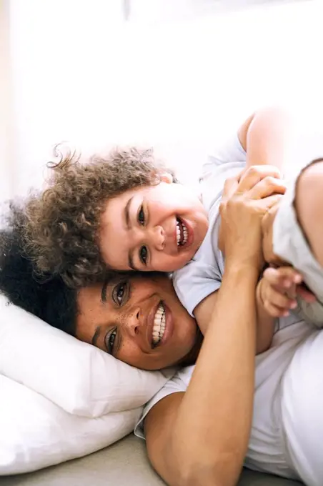 Portrait of mother and little son having fun together