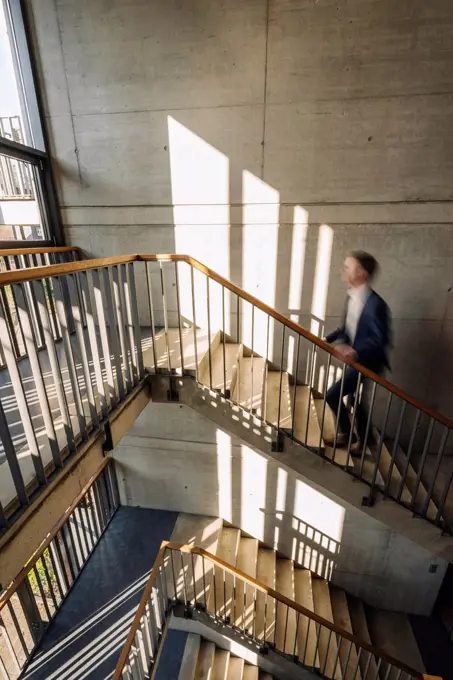 Businessman walking up stairs