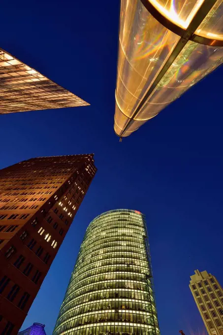 Germany, Berlin, Potsdamer Platz, skyscrapers illuminated at dusk