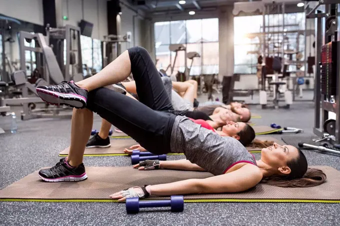 Group of athletes exercising in gym