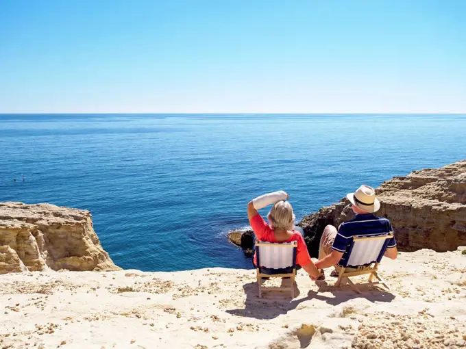 Spain, Andalusia, Cabo de Gata, back view of couple looking at the sea