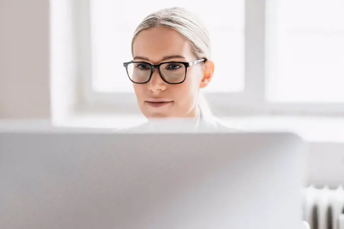 Portrait of businesswoman working with computer