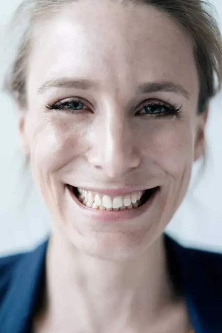 Portrait of grinning woman, close-up