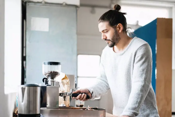 Man preparing espresso with espresso machine