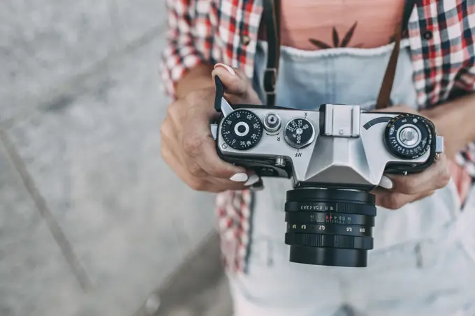 Close-up of woman with a camera