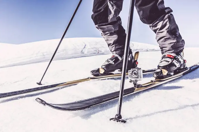 Close-up of skier with action cam in winter landscape