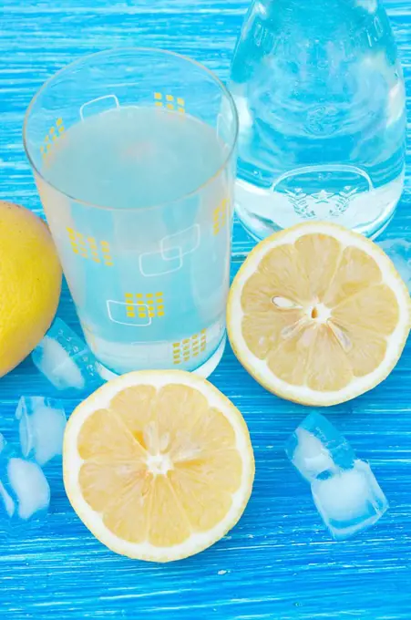 Germany, Baden Wuerttemberg, Lemonade juice on wooden table, close up