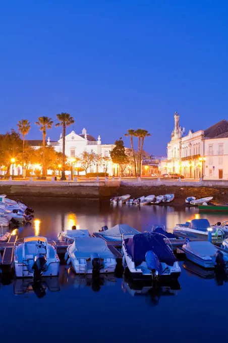 Portugal, Faro, Boats in harbour, old town in background