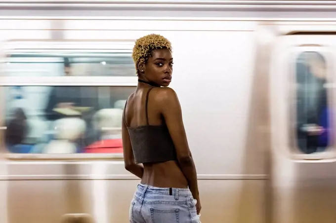 USA, New York City, portrait of woman on subway station platform