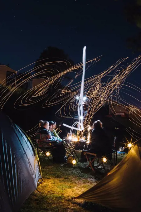 France, group of friends camping at night