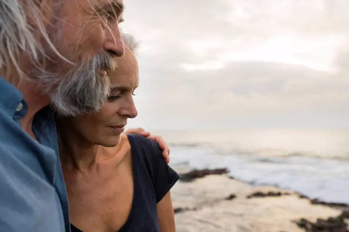 Portrait of a handsome senior couple at the sea