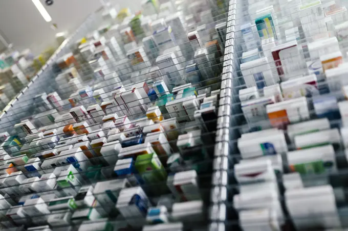 Medicine in shelves in commissioning machine in pharmacy